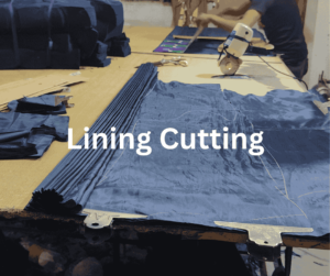 Cut navy blue lining fabric on cutting master table with cutting machine